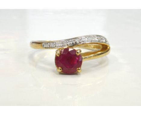 RUBY AND DIAMOND RINGthe central round brilliant cut ruby approximately 0.7cts, in unusual diamond set twist setting, on nine