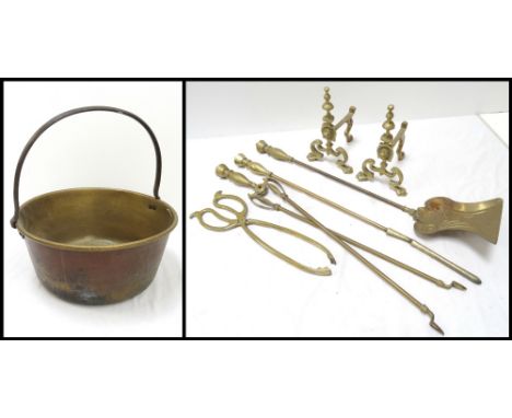 EARLY 20th CENTURY BRASS PRESERVE PAN with a fixed iron hoop handle, 37.5cm wide; and a set of Georgian style brass fire tool