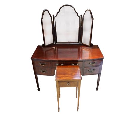 MAHOGANY KNEEHOLE MIRROR BACK DRESSING TABLEwith three shaped mirrors above a bow front with an arrangement of five drawers, 