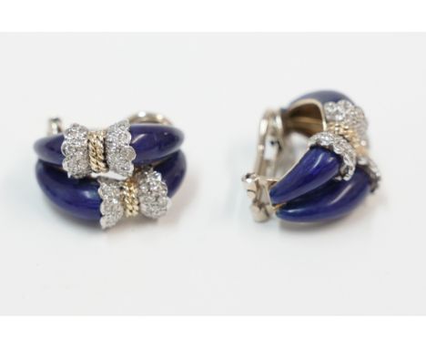 Pair of 18ct yellow and white gold Diamond set bow effect earrings with blue enamel. Total item weight approximately 17.67 gr
