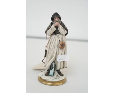 Capodimonte figure of a man lighting his pipe. 19cm high