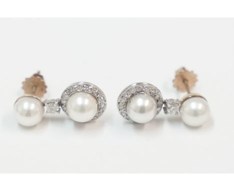 Pair of 18ct drop earrings, with each set with single cultured pearl, with round Diamond underneath, with another cultured pe