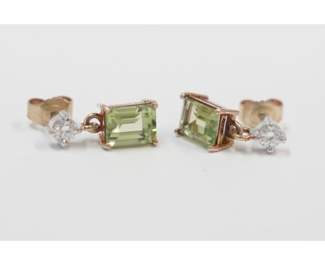 Pair of 18ct yellow and white gold earrings, each one set with 6mm x 8mm rectangular Peridot suspended beneath a 0.16ct round