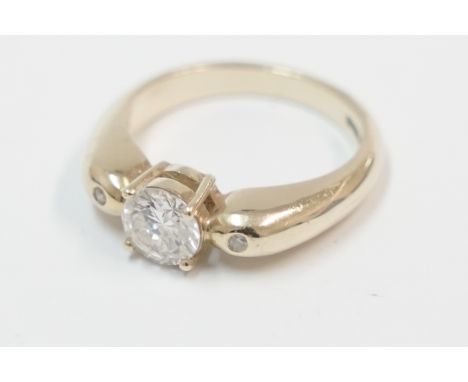 18ct Diamond solitaire ring, approx. 0.75ct with Diamond set in each shoulder. Size L.Total item weight approximately 6.23 gr