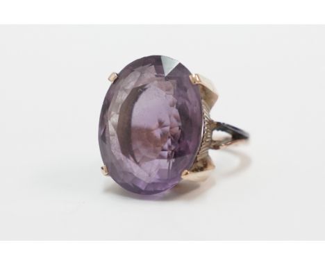 Gold, no hallmark ring, set with single Amethyst, approx. 23mm x 18mm. Size K. Total item weight approximately 14.60 grams.