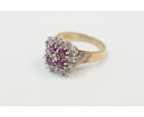 18ct yellow and white gold ring, comprising of 4 Rubies set in a square, with single Diamond in the centre, surrounded by 12 