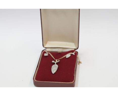 Diamond set tear drop shaped cluster pendant on 9ct anchor link chain with matching earrings. Chain with adjustable length 16