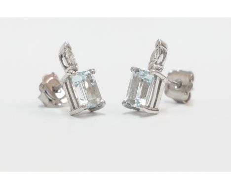 Pair of 18ct white gold rectangular 7mm x 5mm Aquamarine earrings, with single Marquise Diamond. Total item weight approximat