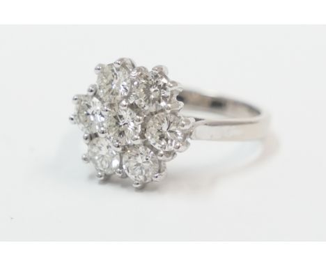 18ct white gold 7 stone Diamond cluster ring, approx. 1.45ct. Size L. Total item weight approximately 4.67 grams.