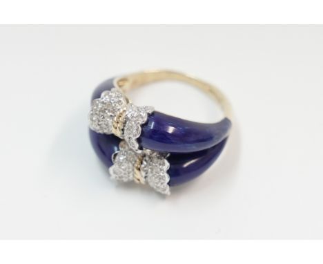 18ct yellow and white gold Diamond set bow effect ring with blue enamel. Size N. Total item weight approximately 8.6 grams.