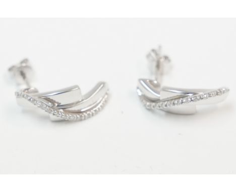 Pair of 9ct white gold Diamond set half hoop earrings. Total item weight approx 3.27 grams