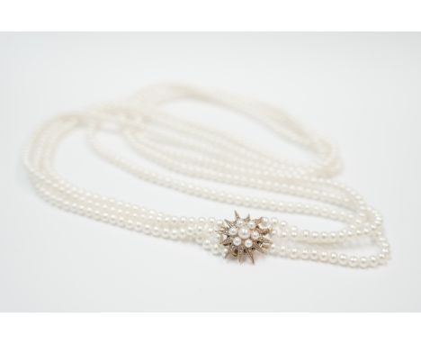 3 row cultured pearl necklace with 9ct gold Pearl clasp. Length approx 26 inches. Total item weight approximately 61.8 grams.