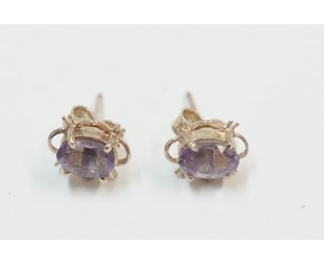 Pair of gold Amethyst stud earrings.Total item weight approximately 1.06 grams.