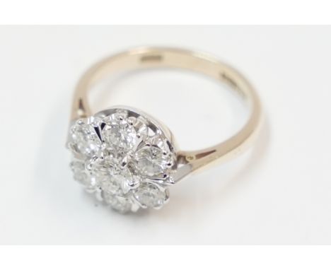 18ct yellow and white gold 7 stone Diamond cluster ring, approx. 1.25ct. Size L. Total item weight approximately 3.94 grams.