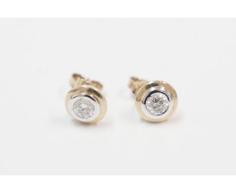 Pair of 18ct yellow and white gold rub-over earrings, each set with single round cut Diamond, approx. 0.50ct total weight. To