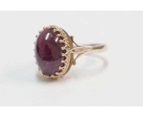 18ct yellow gold ring, set with single Cabachon Ruby, approx. 14mm x 9mm. Size M.Total item weight approximately 6.88 grams.