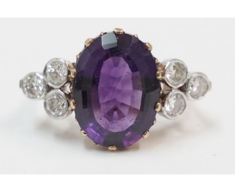 18ct large oval Amethyst ring, set with 3 round Diamonds on each side. Size M.Total item weight approximately 7.22 grams.