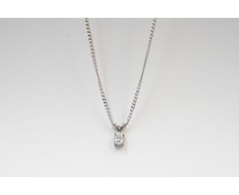 18ct white gold pendant, set with single oval Diamond, approx. 0.32ct, on 18ct white gold curb chain, approx 16 inches. Total