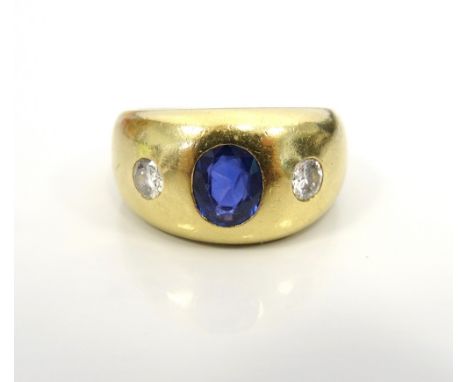 SAPPHIRE AND DIAMOND RING BY ANNABEL JONESthe flush set central oval cut sapphire flanked by a round cut diamond to each side