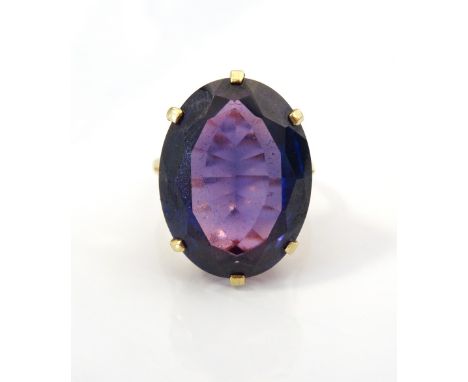 LARGE SYNTHETIC ALEXANDRITE SINGLE STONE DRESS RINGon nine carat gold shank, ring size M