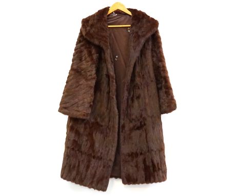 LADY'S VINTAGE SQUIRREL FUR COATwith a shawl collar and hook closure, the lining decorated with leaf motifs and bearing the m