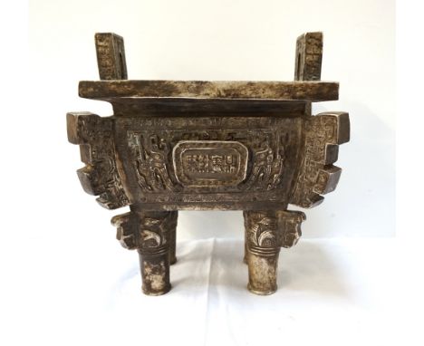 ANGLO TIBETAN WHITE METAL CENSERwith pierced side handles above a shaped body with decorative panels and step shaped corners 