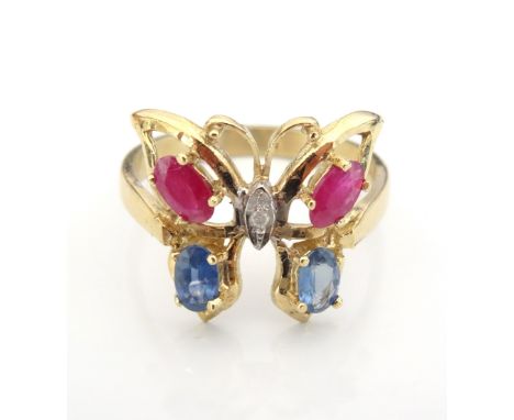 UNUSUAL RUBY, SAPPHIRE AND DIAMOND DRESS RINGthe gemstones in butterfly setting, on nine carat gold shank, ring size N