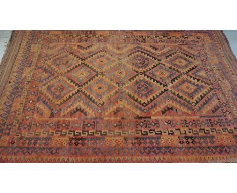 LARGE VINTAGE CENTRAL ASIAN FLOOR RUGwith geometrical design and fringed ends, 401cm long x 245cm wide