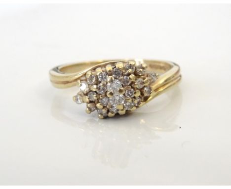 DIAMOND CLUSTER RINGon nine carat gold shank with twist setting, ring size L
