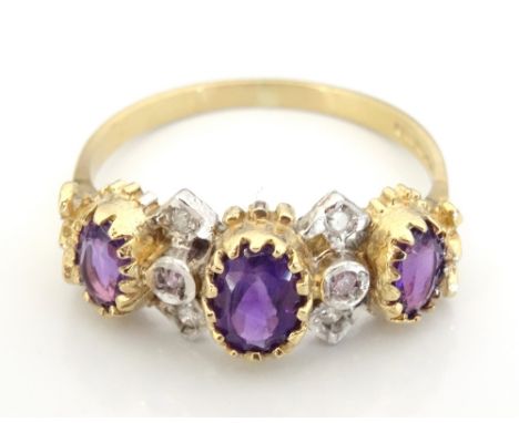 AMETHYST AND DIAMOND RINGthe three graduated oval cut amethysts with small diamonds between, on nine carat gold shank, ring s