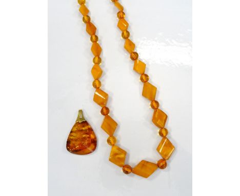 AMBER BEAD NECKLACE AND AMBER PENDANTthe necklace with alternating diamond shaped and circular beads, complete with jeweller'