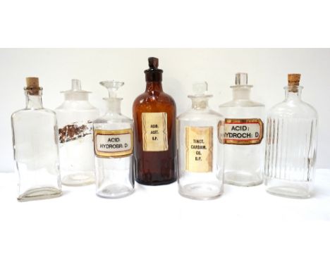 SELECTION OF SEVEN VINTAGE CHEMIST BOTTLESsome with shaped tablet stoppers and two with corks, two bearing content labels wit
