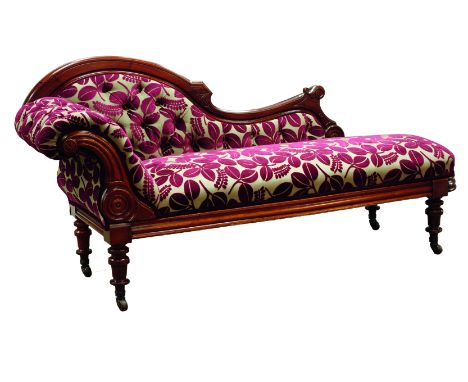 Late Victorian walnut framed chaise longue, scrolled buttoned back with carved detail, upholstered in floral fabric, turned s
