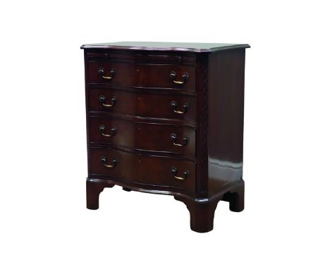 Early 20th century Chippendale style serpentine chest, brushing slide above four graduated drawers, blind fret canted corners