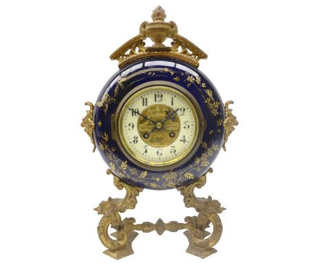 19th century French gilt metal mounted ceramic circular mantel clock, cream Arabic dial with urn centre and cresting, twin tr