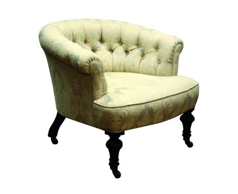 Victorian walnut framed tub shaped armchair, buttoned back with deep seat, upholstered in damask fabric, on turned baluster s