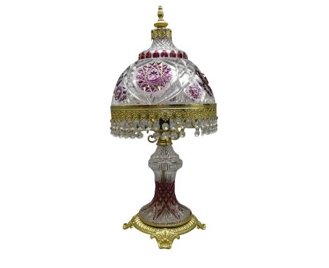 20th century Bohemian crystal table lamp with ruby red overlay, gilt metal mounts and cut glass drops, H58cm    Condition Rep