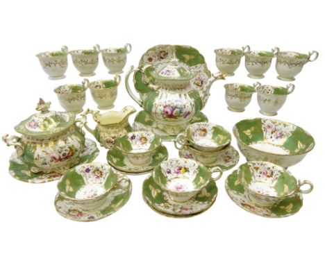 19th century porcelain tea service in the manner of Coalport, decorated with gilt bordered reserves on green ground, painted 