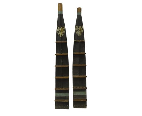 Pair early 20th century oar blades converted to pipe racks, each hand painted with Gonville & Caius College, Cambridge crest,