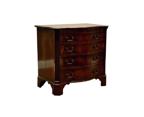 Chippendale style mahogany serpentine front Bachelors chest, with brushing slide above four long drawers, acanthus capped flu