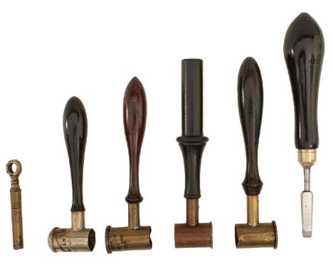 A SMALL COLLECTION OF ACCESSORIES, to include four shot or powder easures, one by Dixon and one by Hawksley, a turnscrew and 