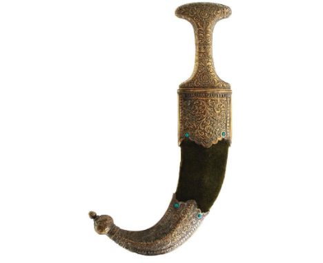 A 19TH CENTURY INDIAN JAMBIYA, 16.5cm sharply curved blade with raised medial ridge, characteristic brass hilt profusely deco