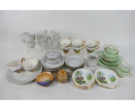 A collection of mixed tea wares to include Royal Imperial Bone China decorated with fox hunting scene. [W]

NOTE: THIS LOT IS