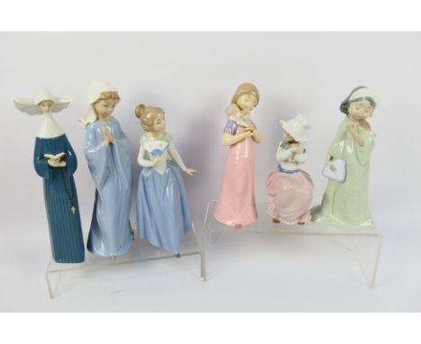 A collection of Lladro and Nao figures, largest approximately 28 cm (h). [W]

NOTE: THIS LOT IS NOT AVAILABLE FOR IN HOUSE SH