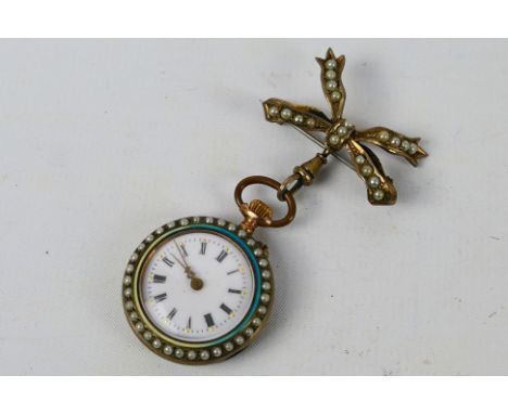 An early 20th century Swiss silver cased fob watch (.800 fineness) with floral enamel decoration (some losses) and pearl set 