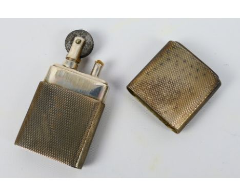 A silver cased cigarette lighter, the Howitt, with engine turned decoration, Sheffield assay 1944, sponsors mark for Dudley R