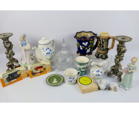 A mixed lot comprising ceramics to include Nao, Royal Doulton and similar, candlesticks and other. [W]

NOTE: THIS LOT IS NOT