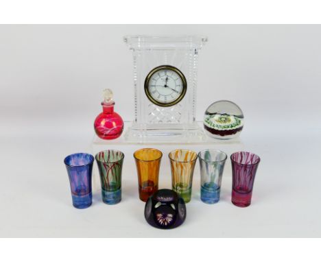 Glassware comprising paperweights to include a millefiore example, a Waterford Crystal mantel clock and other. [W]