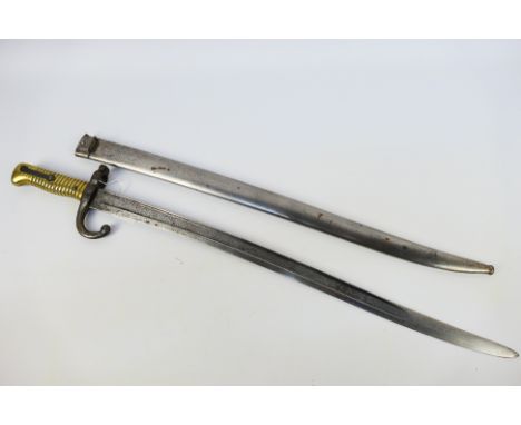 A French M. 1866 bayonet and scabbard, 56 cm (l) blade. [W]

Note: This lot is not for sale to people under the age of 18. By