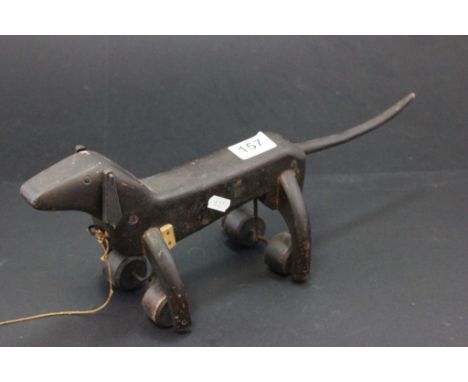 Folk Art child's wooden pull along toy dog with wagging tail and nodding head